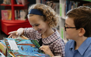 A photo showing two students at St Brendan’s Annandale learning and on their way to 2026 NAPLAN results success